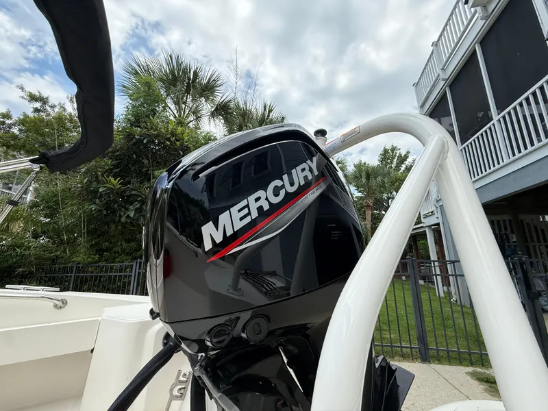 Slide: The Image of 2022 Boston Whaler 160 Super Sport with Mercury engine, outdoor setting. - 7