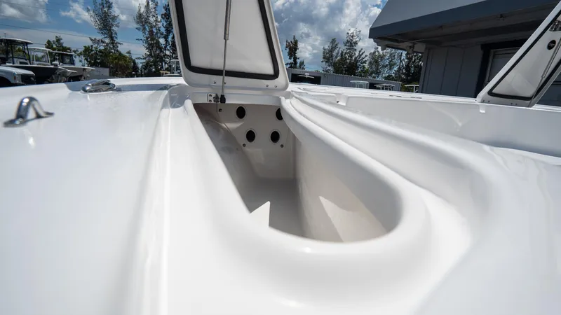 Slide: The Image of 2025 Tidewater 2110 Bay Max boat storage compartment with open hatch. - 10