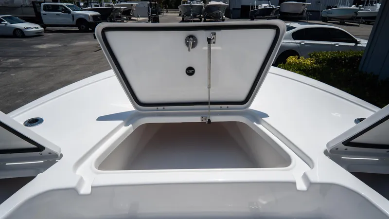Slide: The Image of 2025 Tidewater 2110 Bay Max boat with open storage compartment. - 11