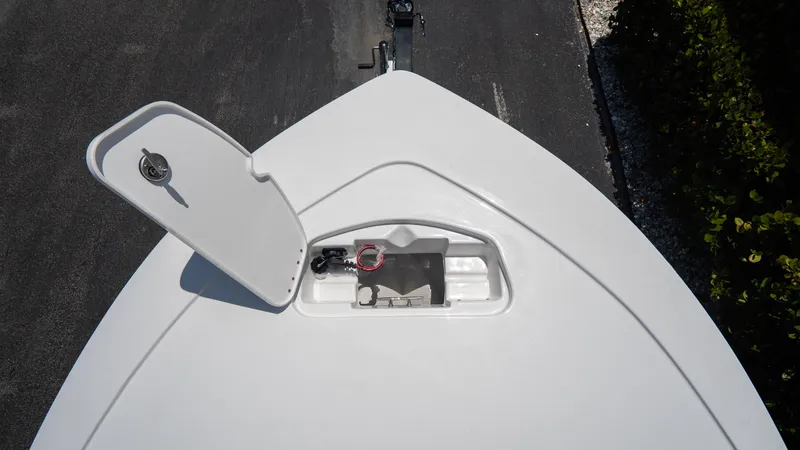 Slide: The Image of 2025 Tidewater 2110 Bay Max boat with open storage compartment. - 12