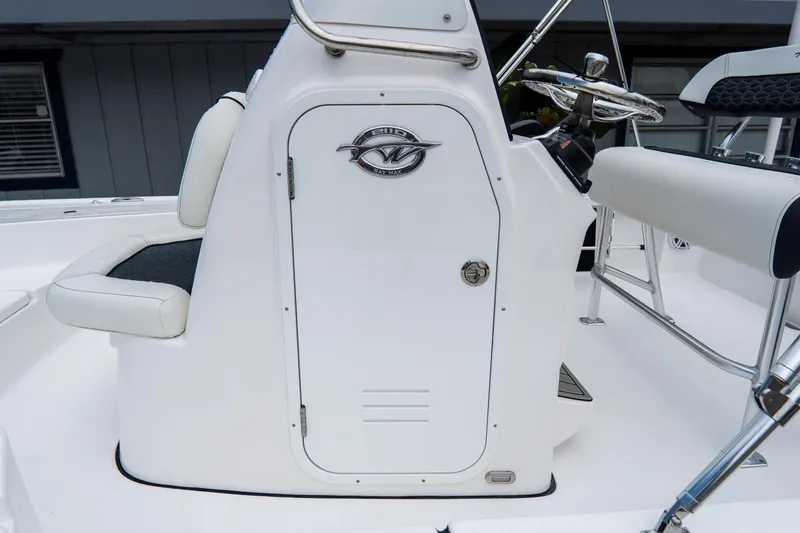 Slide: The Image of 2026 Tidewater 2110 Bay Max boat console with steering wheel and seating. - 13