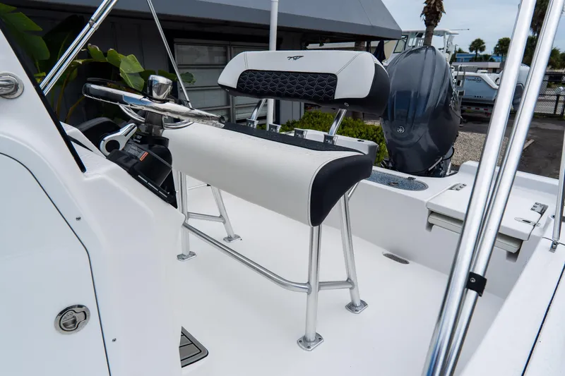 Slide: The Image of 2026 Tidewater 2110 Bay Max boat interior with steering console and seating. - 18