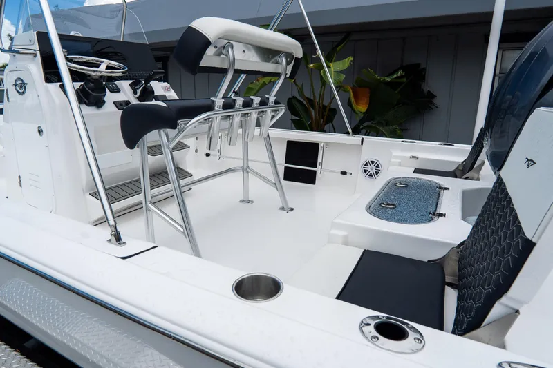 Slide: The Image of 2026 Tidewater 2110 Bay Max boat interior with seating and console. - 22