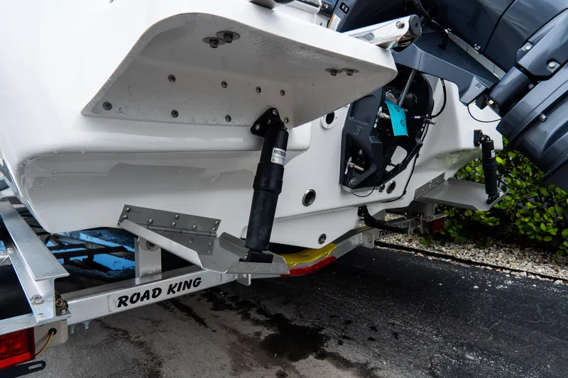 Slide: The Image of 2026 Tidewater 2110 Bay Max boat on Road King trailer, rear view. - 24