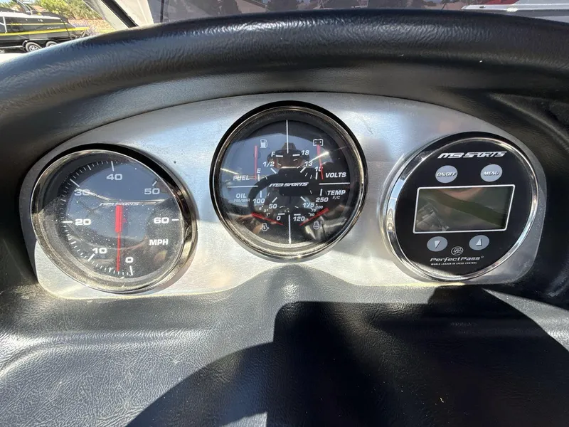 Slide: The Image of Dashboard of a 2006 MB Sport 220v with speedometer and digital display. - 15
