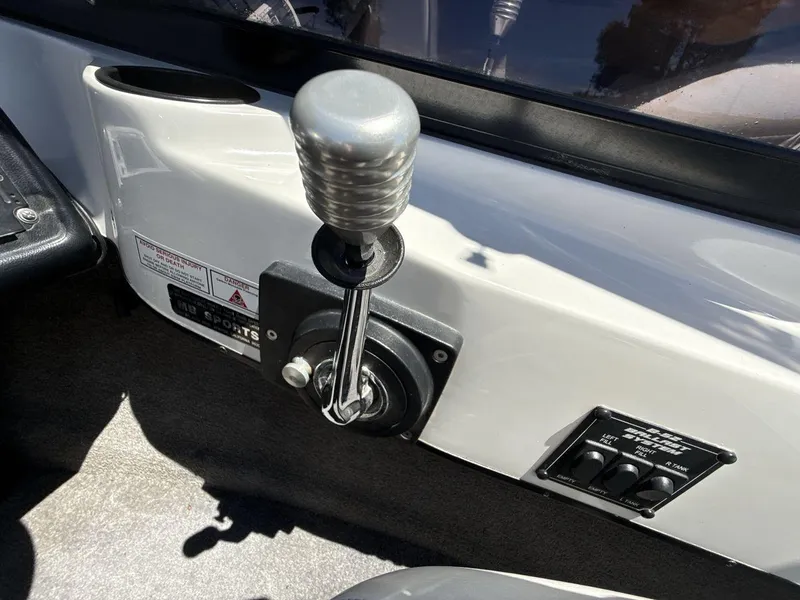 Slide: The Image of 2006 MB Sport 220v boat control panel with gear shift and switches. - 16