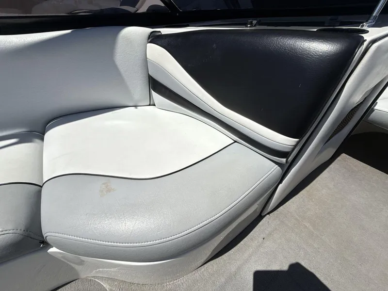 Slide: The Image of Rear seat of 2006 MB Sport 220v boat with gray and black upholstery. - 17
