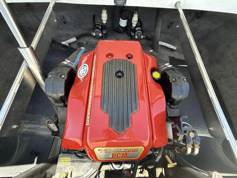 Slide: The Image of Red PCM engine in a 2006 MB Sport 220v boat, showcasing detailed components. - 20