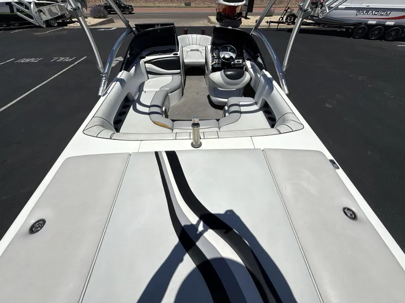 Slide: The Image of 2006 MB Sport 220v boat interior with white seating and steering wheel. - 9