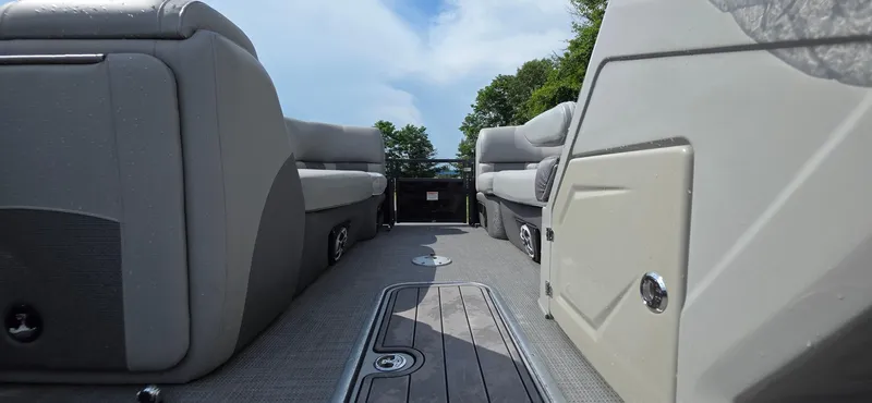 Slide: The Image of 2022 Regency 230 LE3 pontoon boat interior with gray seating and sleek design. - 14