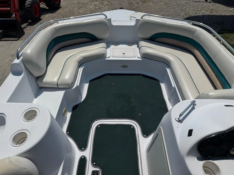 Slide: The Image of 2001 Hurricane FunDeck GS 201 OB boat interior with cushioned seating and cup holders. - 11