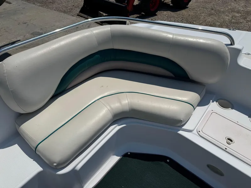 Slide: The Image of 2001 Hurricane FunDeck GS 201 OB boat seating with white and teal upholstery. - 12