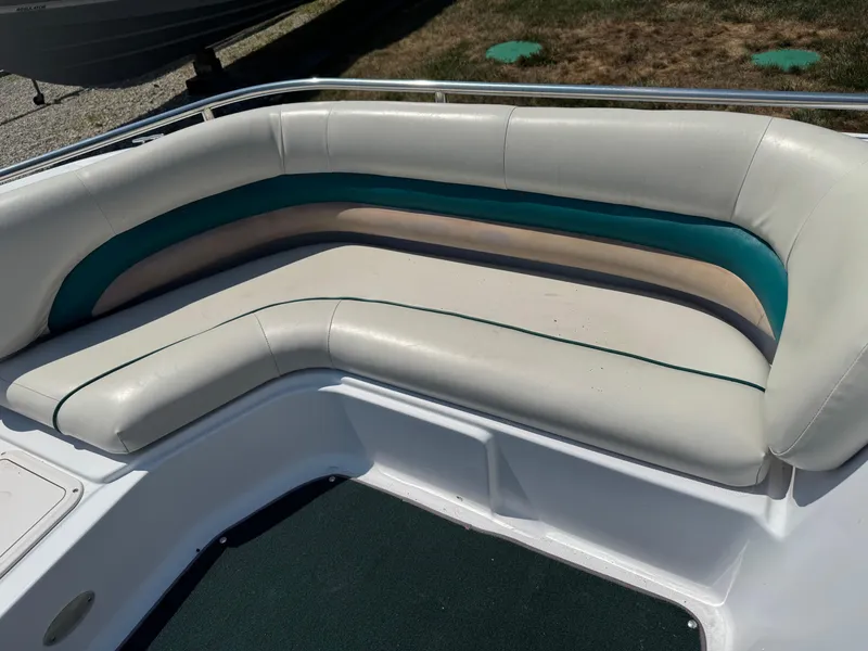 Slide: The Image of 2001 Hurricane FunDeck GS 201 OB boat seating with white and teal upholstery. - 13