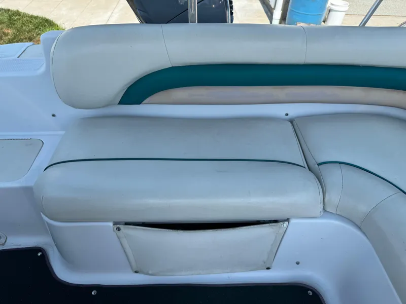 Slide: The Image of 2001 Hurricane FunDeck GS 201 OB boat seating with white and teal upholstery. - 16