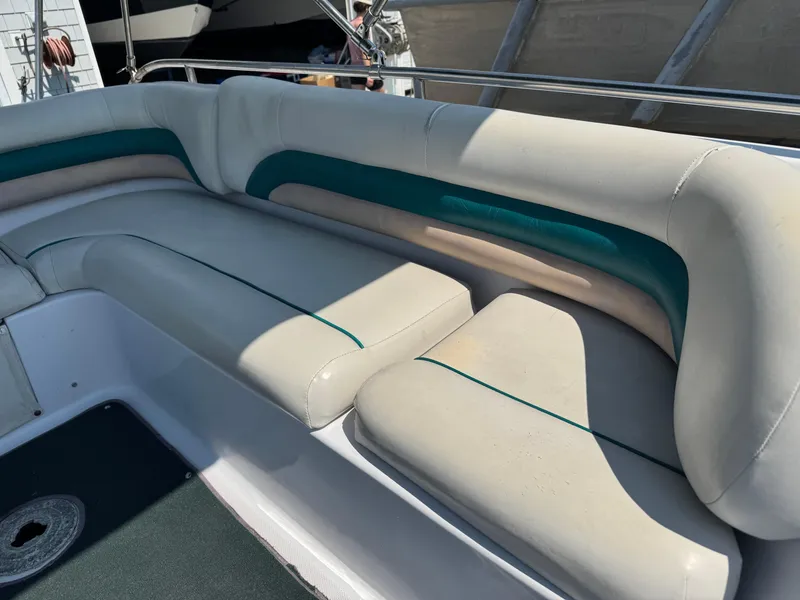 Slide: The Image of 2001 Hurricane FunDeck GS 201 OB boat interior with white and teal seating. - 17
