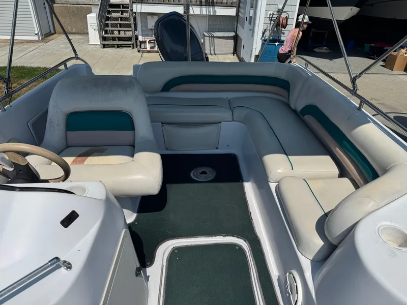 Slide: The Image of 2001 Hurricane FunDeck GS 201 OB boat interior with spacious seating and steering wheel. - 18