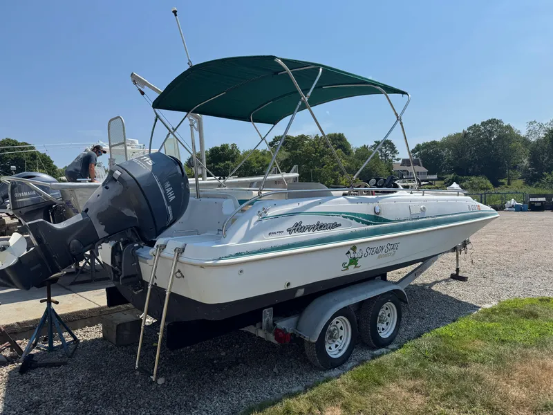 Slide: The Image of 2001 Hurricane FunDeck GS 201 OB boat on trailer with Yamaha outboard motor and green canopy. - 22