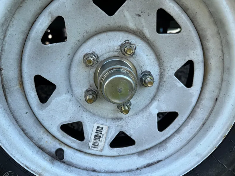 Slide: The Image of Close-up of a 2001 Hurricane FunDeck GS 201 OB trailer wheel hub. - 26