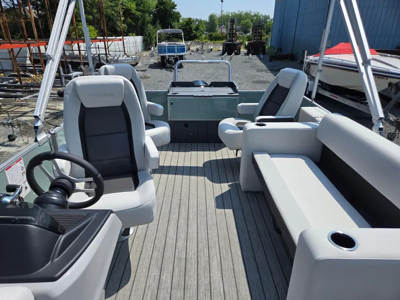 Slide: The Image of 2026 Harris Cruiser 210 pontoon boat interior with modern seating and steering wheel. - 14