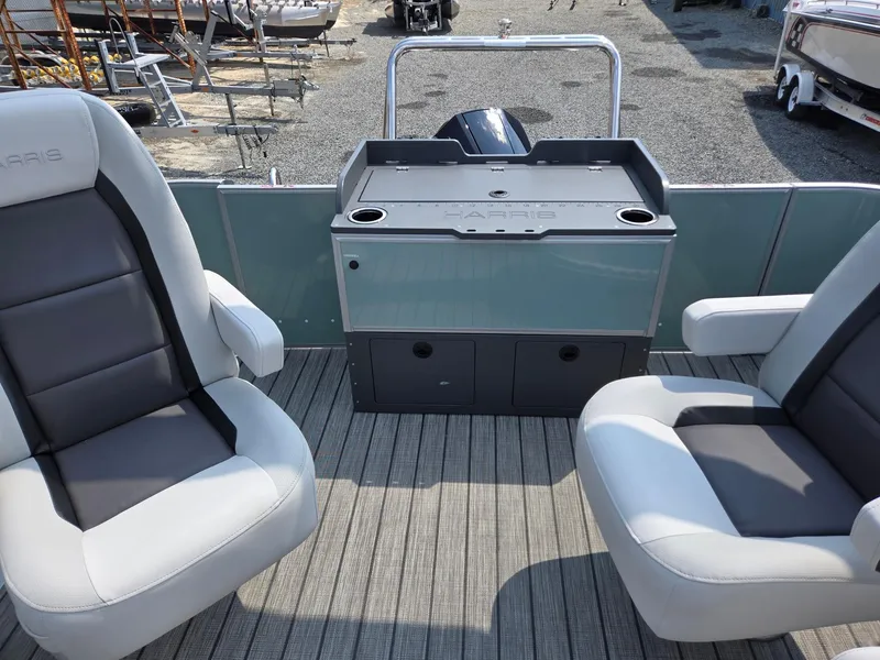 Slide: The Image of 2026 Harris Cruiser 210 boat interior with seating and storage compartments. - 22