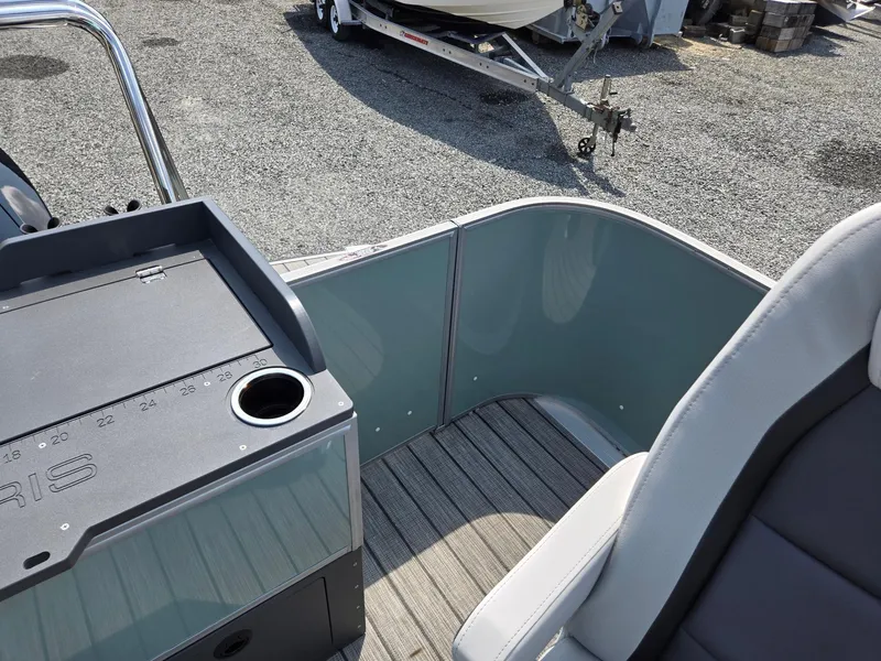 Slide: The Image of 2026 Harris Cruiser 210 boat interior with seating and console, featuring modern design elements. - 24