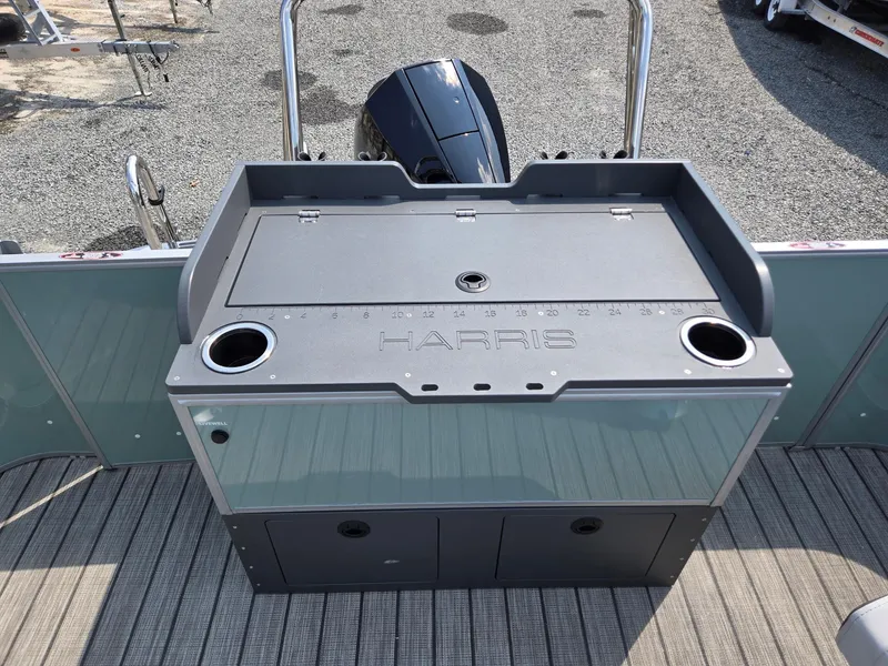 Slide: The Image of 2026 Harris Cruiser 210 boat deck with storage and cup holders. - 25