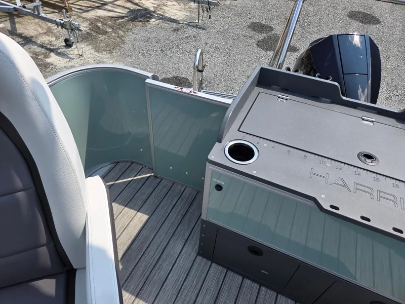 Slide: The Image of 2026 Harris Cruiser 210 boat interior with seating and control panel, featuring sleek design and modern amenities. - 26