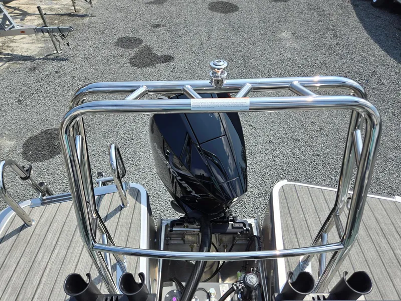 Slide: The Image of 2026 Harris Cruiser 210 boat with sleek black motor and stainless steel railing. - 27