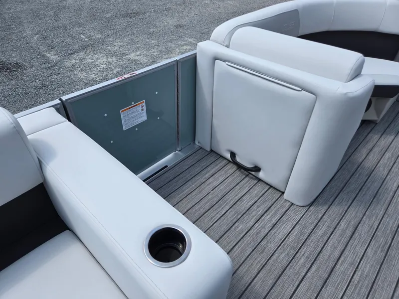 Slide: The Image of 2026 Harris Cruiser 210 boat interior with white seating and cup holder on striped flooring. - 35