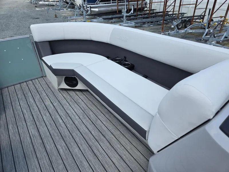Slide: The Image of Luxurious seating on 2026 Harris Cruiser 210 boat, featuring sleek design and cup holders. - 38