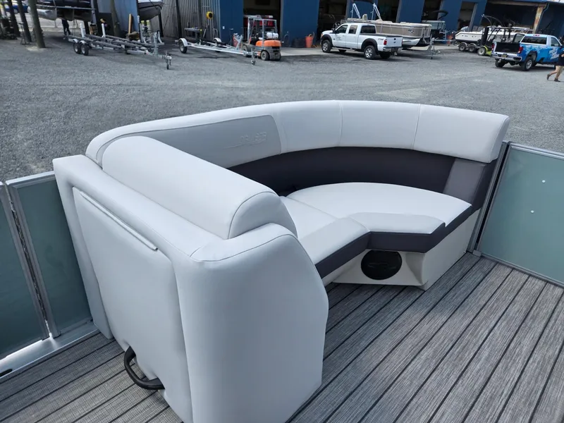 Slide: The Image of 2026 Harris Cruiser 210 boat interior with gray seating and wood-style flooring. - 39