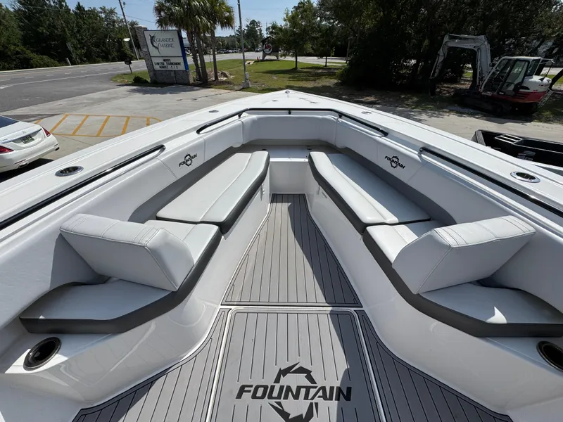 Slide: The Image of 2022 Fountain 38TE boat interior with cushioned seating and branded flooring. - 19
