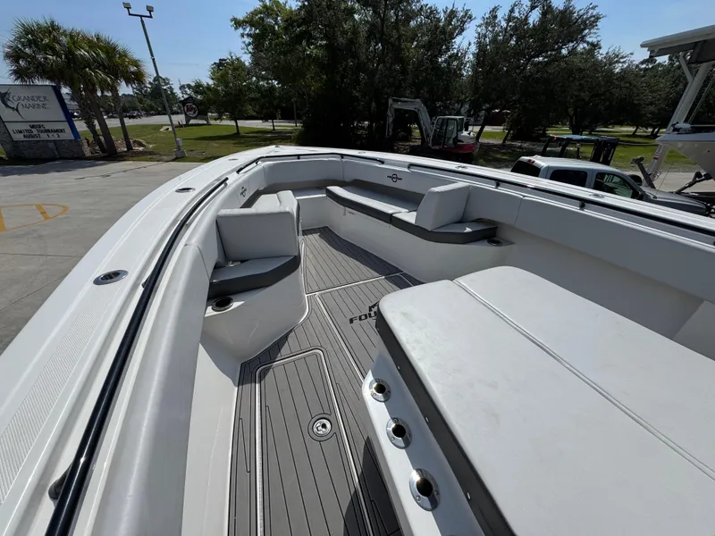 Slide: The Image of 2022 Fountain 38TE boat interior with spacious seating and sleek design. - 20