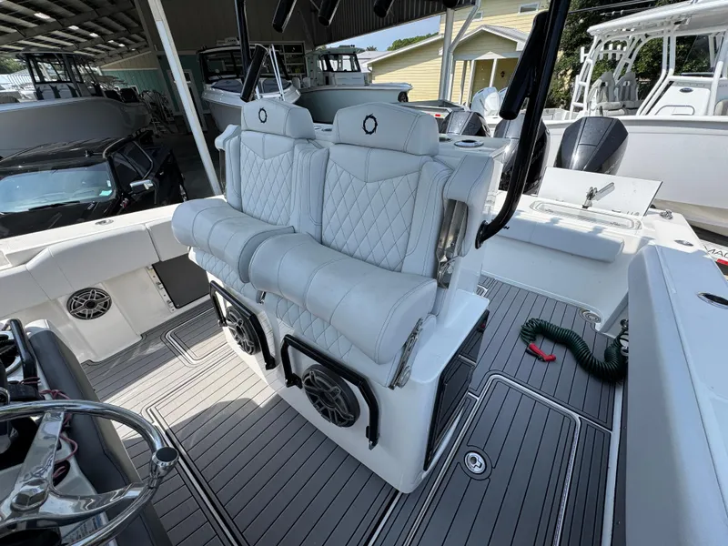 Slide: The Image of 2022 Fountain 38TE boat interior with white seating and modern design. - 32