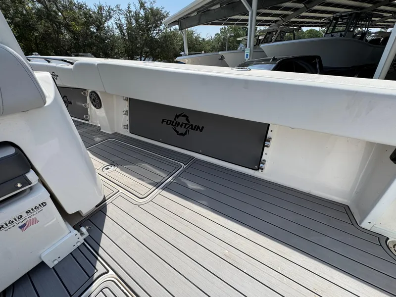 Slide: The Image of 2022 Fountain 38TE boat interior with sleek deck and branded panel. - 38