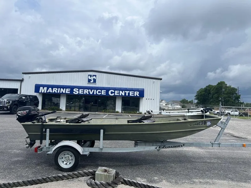 Slide: The Image of 2010 Triton 14' Jon boat on trailer at Marine Service Center. - 5