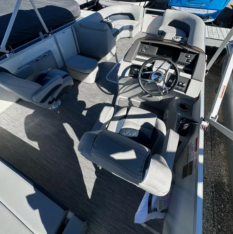 Slide: The Image of 2024 Bennington L 23 Swingback interior with modern helm and seating arrangement. - 5