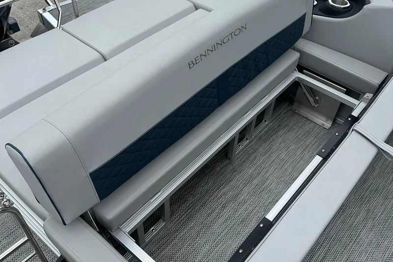 Slide: The Image of 2024 Bennington L 23 Swingback boat interior with gray and blue seating. - 8