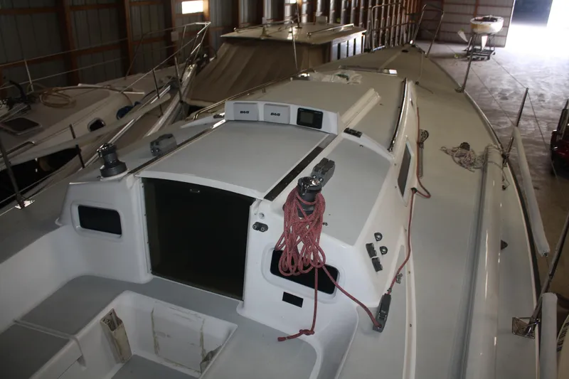 Slide: The Image of 2002 J Boats J/105 sailboat in storage, showing deck and cockpit details. - 11