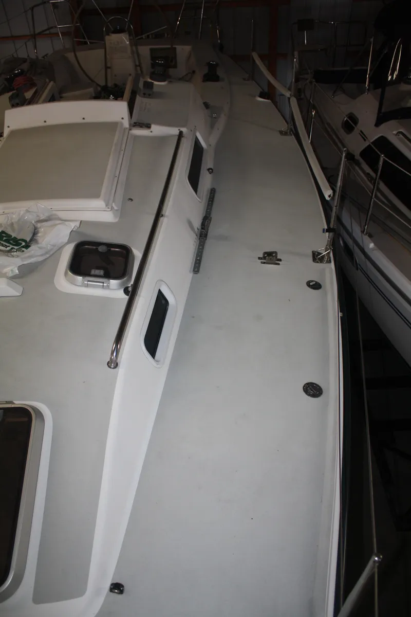 Slide: The Image of 2002 J Boats J/105 sailboat deck with sleek design and railing. - 24