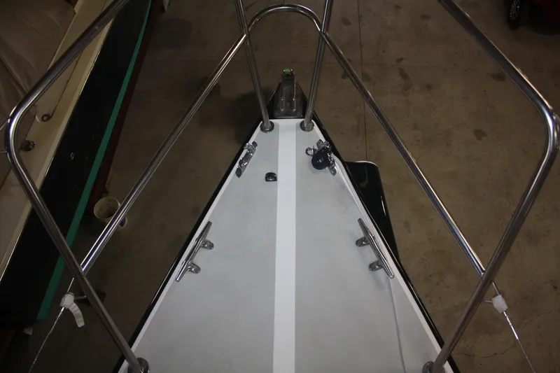 Slide: The Image of Bow view of 2002 J Boats J/105 sailboat in a workshop setting. - 25