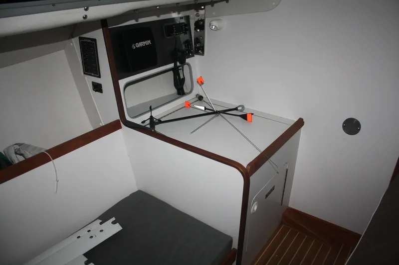 Slide: The Image of 2002 J Boats J/105 cabin interior with navigation equipment and storage area. - 27