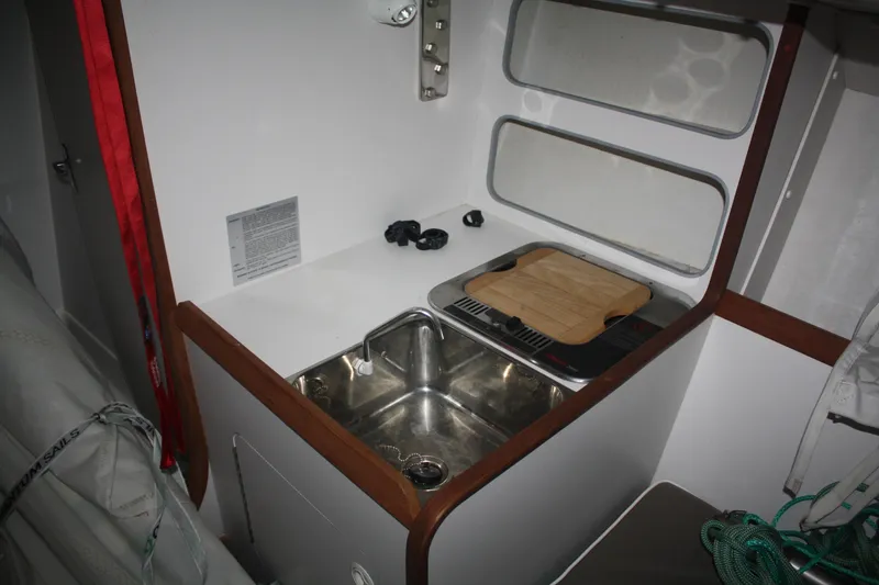 Slide: The Image of 2002 J Boats J/105 interior galley with sink, stove, and storage. - 31