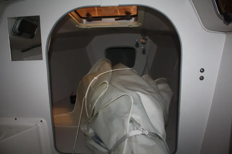 Slide: The Image of Interior cabin of a 2002 J Boats J/105 sailboat with stored sails. - 36