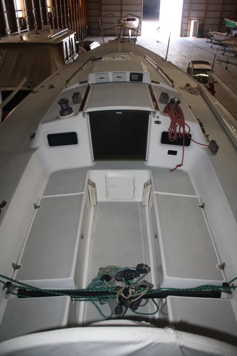 Slide: The Image of 2002 J Boats J/105 sailboat interior with ropes and equipment in storage facility. - 9