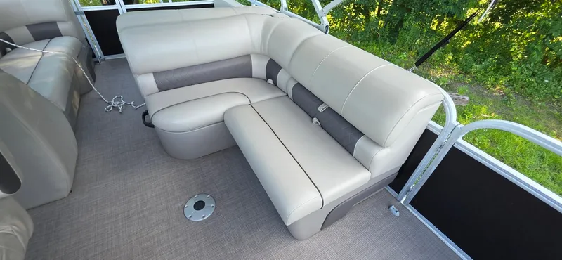 Slide: The Image of 2021 Sun Tracker 22 Party Barge RF interior with beige seating and gray accents. - 5