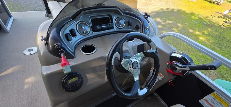 Slide: The Image of Steering console of a 2021 Sun Tracker 22 Party Barge RF pontoon boat. - 9
