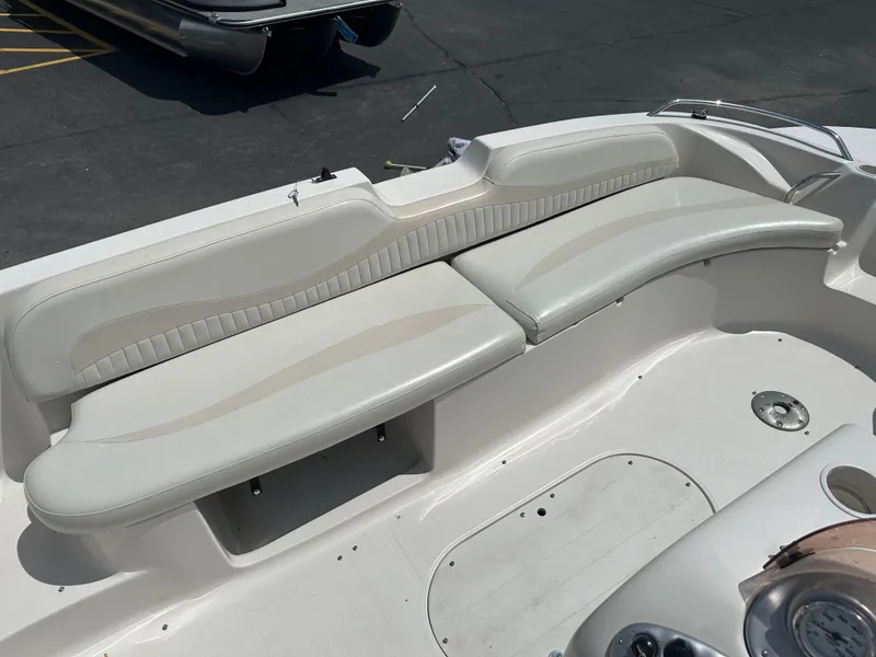 Slide: The Image of 2007 Smoker Craft Vectra 2040 boat interior with white seating and dashboard. - 11