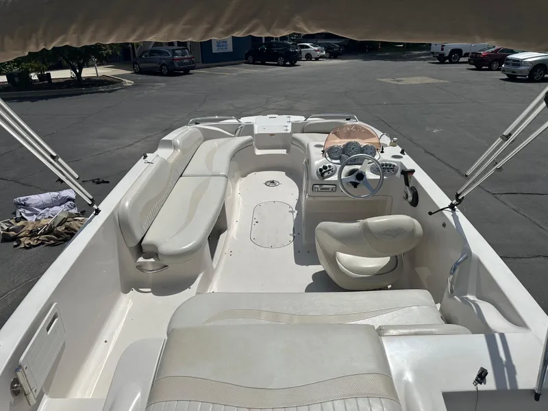 Slide: The Image of 2007 Smoker Craft Vectra 2040 boat interior with white seating and steering console. - 12