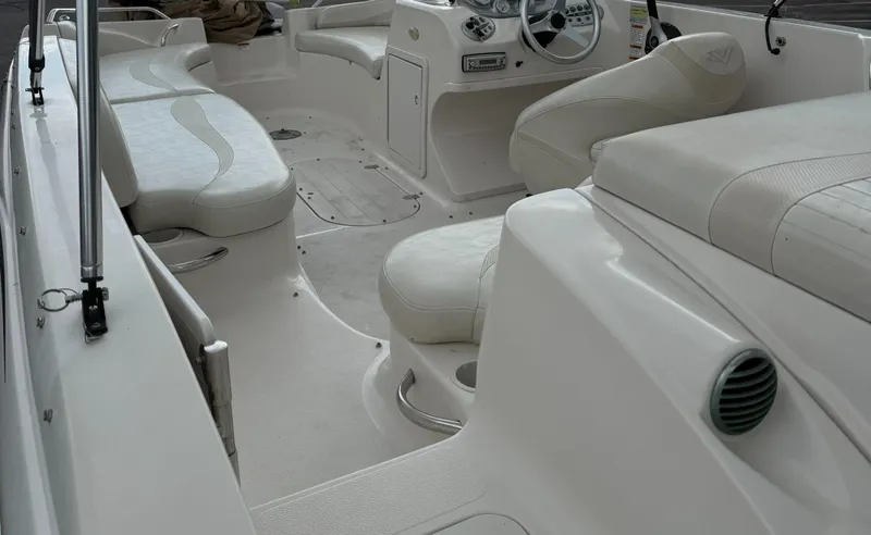 Slide: The Image of 2007 Smoker Craft Vectra 2040 boat interior with white seating and steering console. - 13